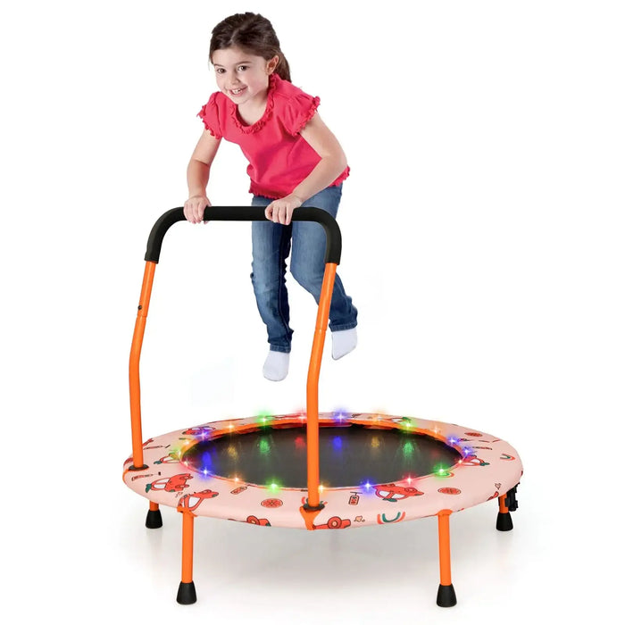 Child playing on a small trampoline with colorful lights on a white background