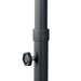 Black metal pole with adjustable knob on a white background