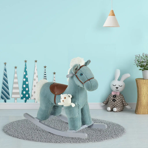 Blue plush rocking horse toy with saddle in a child's room with decorative trees and stuffed bunny