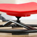 Close-up of a red seat on a chair with a blurred background