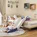 Toddler sliding down blue and white toy slide from bed in cozy beige kids bedroom