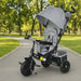 Gray and black baby stroller with canopy in a park setting
