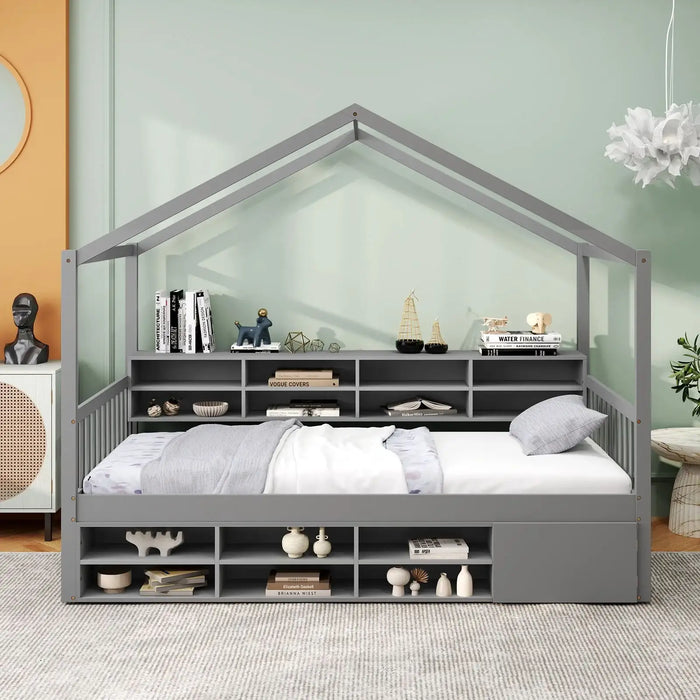 Gray house-shaped bed with bookshelves in a room with a light green wall.