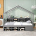 Gray house-shaped bed with bookshelves in a room with a light green wall.