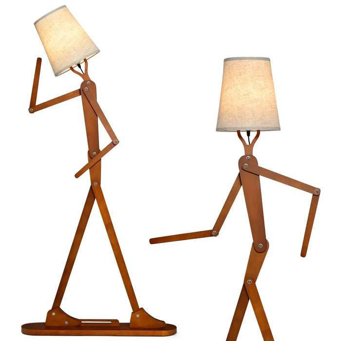 Unique wooden tall floor lamp shaped like a walking person with adjustable arms and fabric lampshade