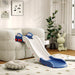 Indoor kids slide with blue and white car design attached to a beige sofa in a modern living room
