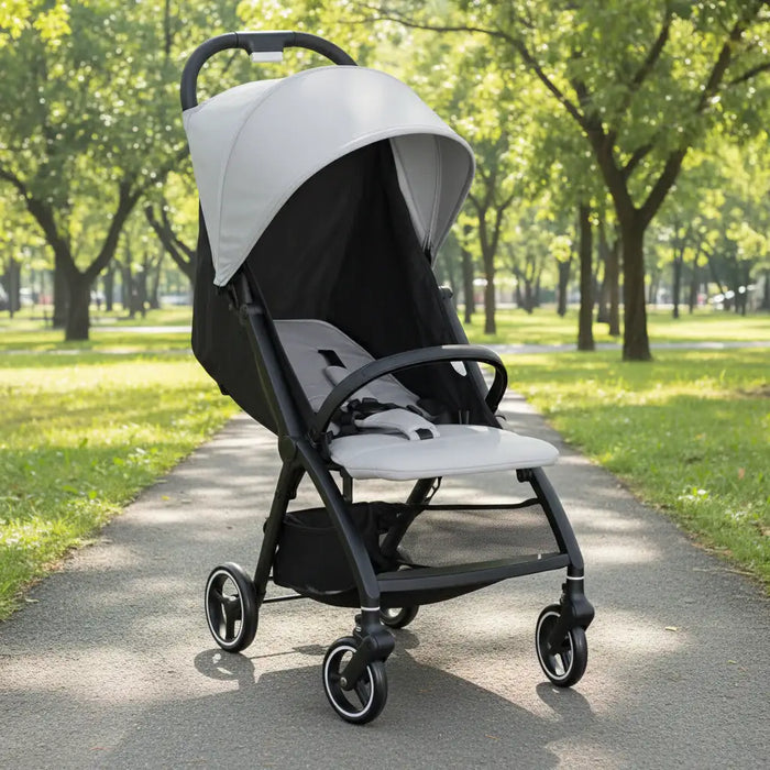 Black and gray stroller in a park setting