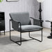 Gray armchair with black metal frame in a room setting