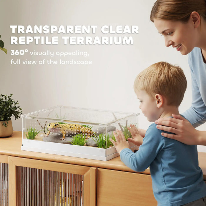 Woman and child looking at a transparent clear reptile terrarium on a wooden surface.