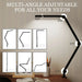 Multi-angle adjustable desk lamp with light on a neutral background