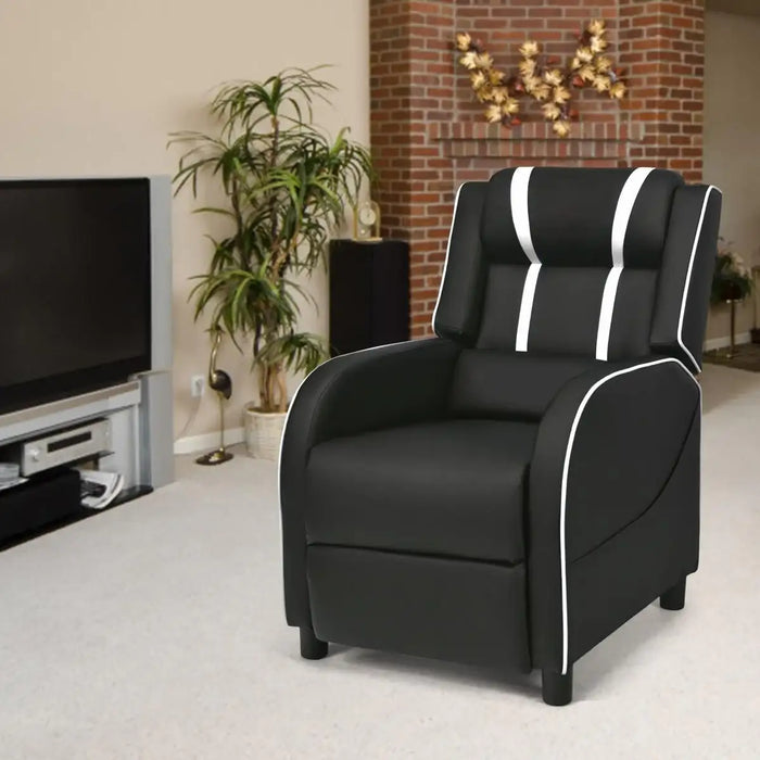 Black recliner chair with white trim in a living room setting.