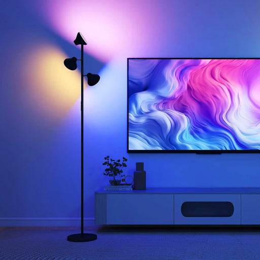 Modern living room with a floor lamp and a TV displaying colorful abstract wallpaper.