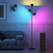 Modern floor lamp with color-changing light in a living room setting