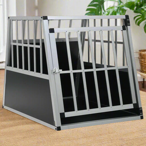 Aluminium and MDF dog car cage, silver pet travel crate on carpet indoors