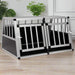 Aluminium and MDF dog car cage with double doors on a wood floor, indoor setting