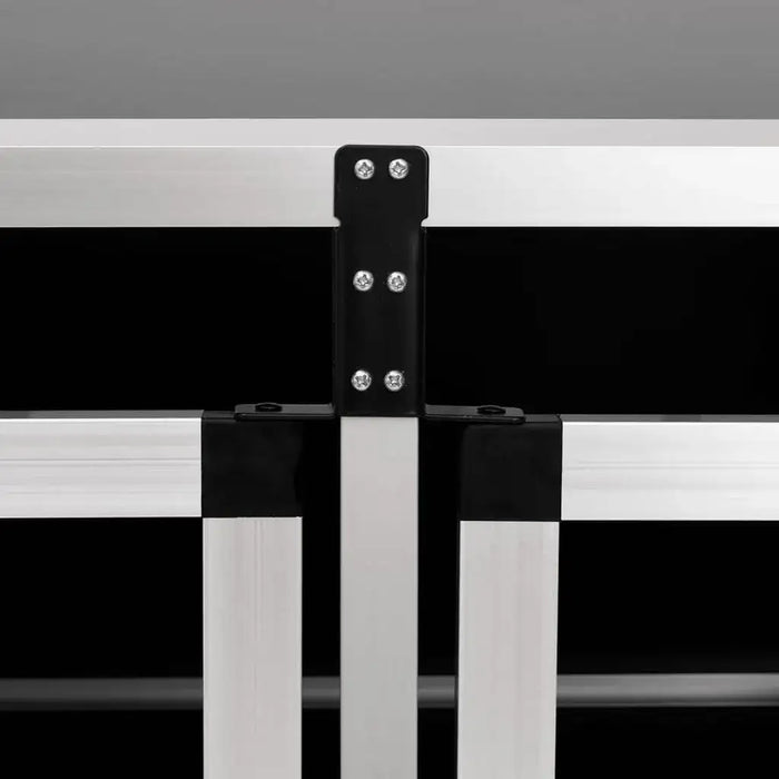 Close-up of aluminum and MDF dog car cage frame with black connectors