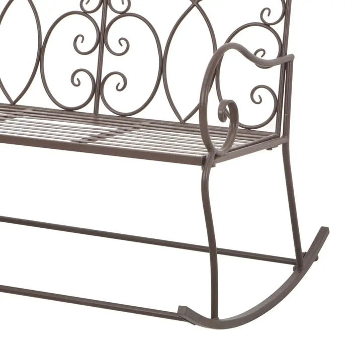 Antique-style brown wrought iron garden rocking bench with decorative scrollwork backrest