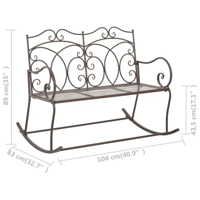 Antique brown wrought iron rocking garden bench with decorative scrollwork and armrests