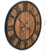 Wooden wall clock with black Roman numerals and measurement details on a white background