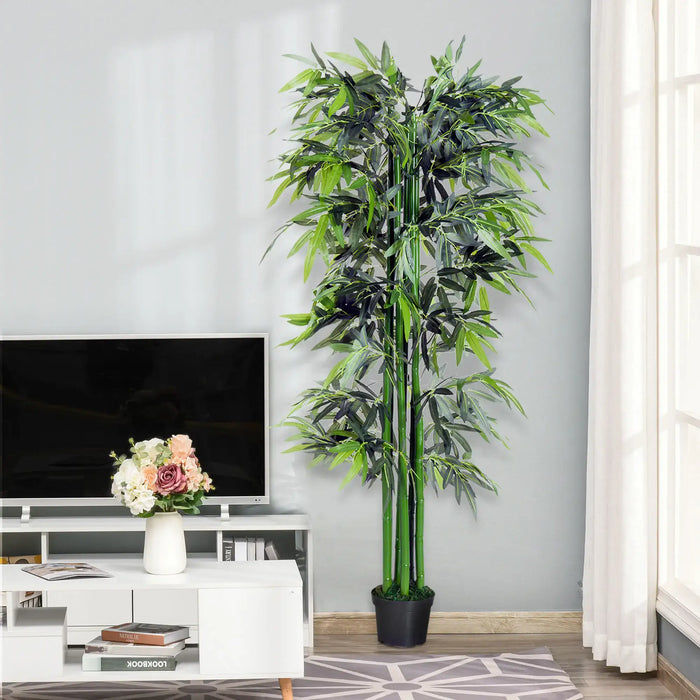Artificial bamboo plant in a living room setting with a TV and decorative items.