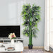 Artificial bamboo plant in a living room setting with a TV and decorative items.