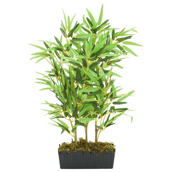 Potted artificial bamboo plant on a white background