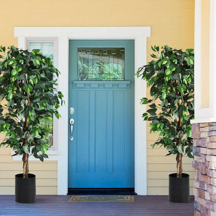 Blue front door with two potted trees on a yellow house exterior