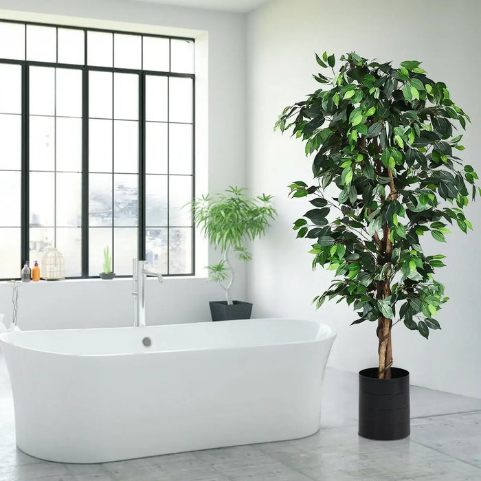 Potted plant in a modern bathroom with a freestanding bathtub and large window.