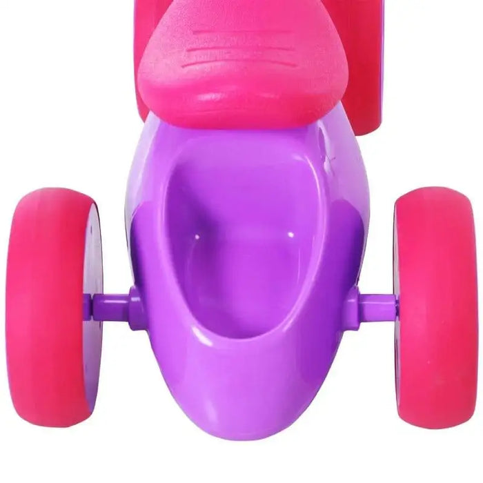 Violet and fuchsia baby balance bike with four rubber wheels, viewed from above