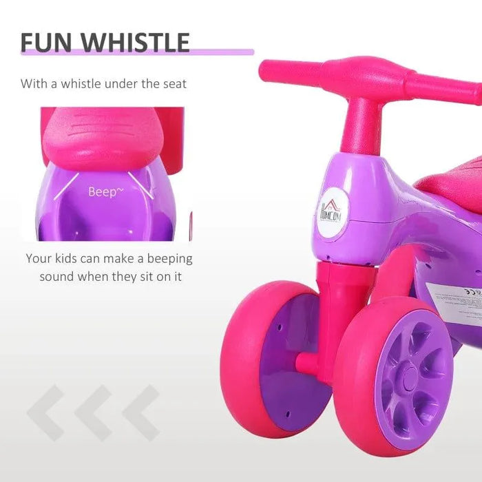Violet and fuchsia baby balance bike with four rubber wheels and whistle feature shown.