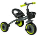 Black and green baby trike with front basket, adjustable seat, and safety features