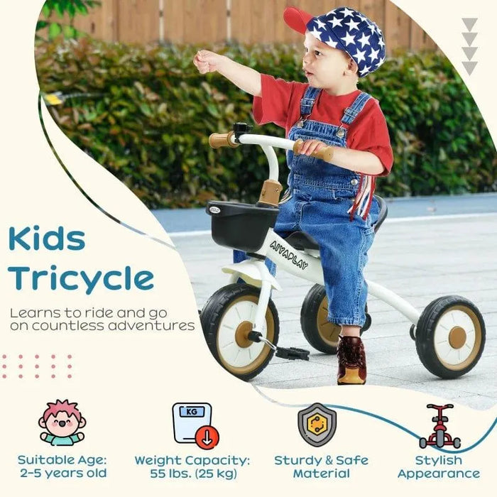 Toddler riding white adjustable kids tricycle with bell and basket outdoors, wearing star cap and overalls