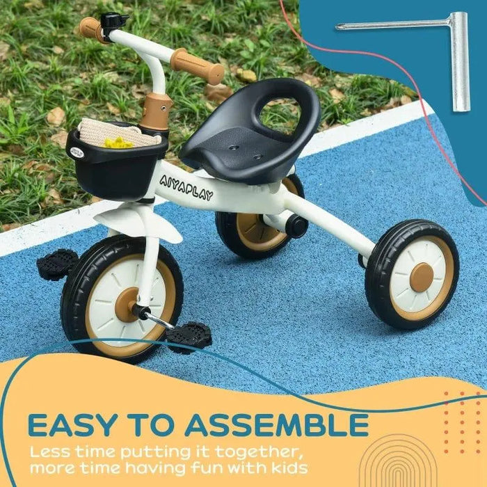 White toddler tricycle with black adjustable seat, front basket, bell and easy assembly tool.