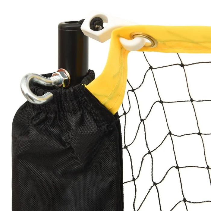 Close-up of adjustable steel frame badminton net with yellow trim and black post.