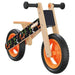 Orange and black balance bike with lightweight plywood frame and adjustable seat