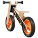 Orange and black balance bike with lightweight plywood frame and adjustable seat
