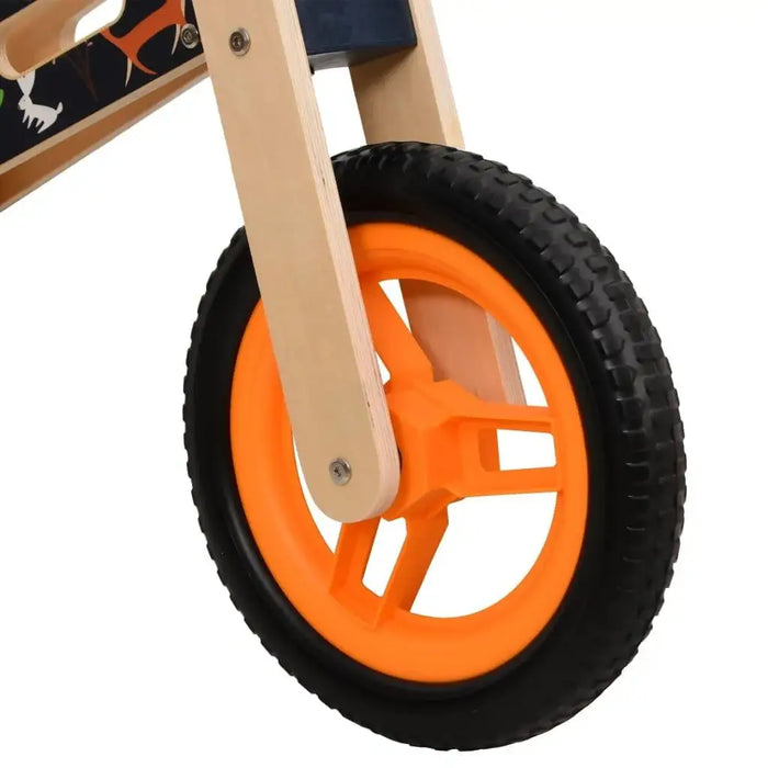 Orange wheel on lightweight plywood frame balance bike for kids