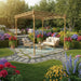 Bamboo garden pergola with outdoor seating set amid colorful flowers and greenery