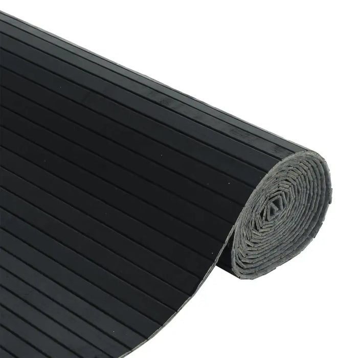 Roll of black ribbed material on a white background