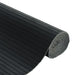Roll of black ribbed material on a white background