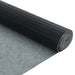 Roll of black protective film on a gray surface