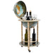 Globe-shaped bar cart with wine bottles and glasses on a white background