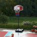 Adjustable outdoor basketball stand with backboard, net, and portable base on a court