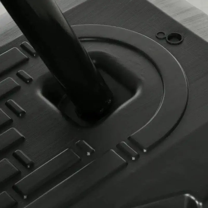 Close-up of basketball stand base with inclined bottom and sturdy pole support