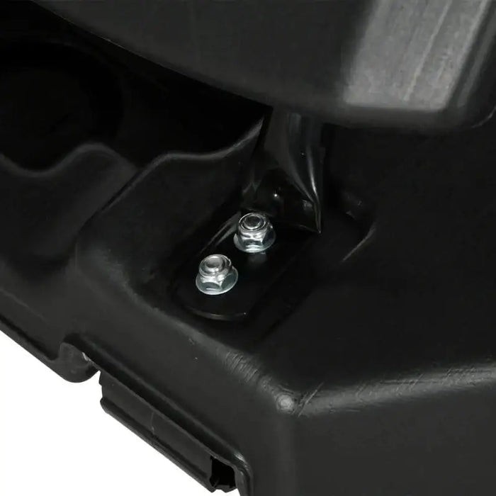 Close-up of black basketball stand base with two metal bolts for secure assembly