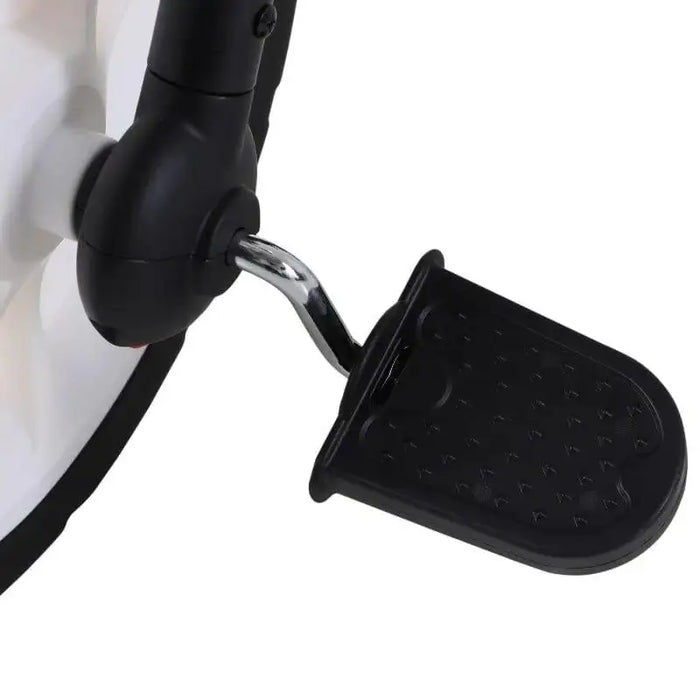 Close-up of a black pedal attached to a kids tricycle crank arm. The pedal, made of plastic, has a textured surface for grip. The crank arm is connected to the tricycle wheel, which is partially visible in the background. Perfect for little ones learning on their first HOMCOM Balance Training Bike with Removable Stabilisers.