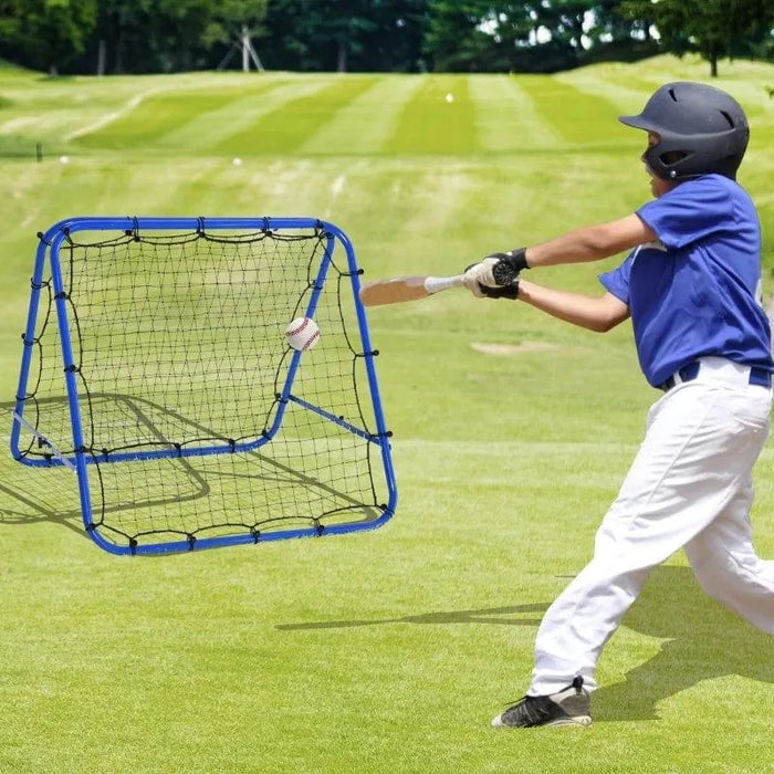 Child in helmet hits baseball toward blue rebounder net on grassy field