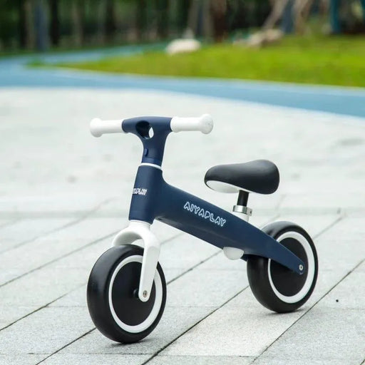 Blue kids balance bike with adjustable seat on outdoor pavement, AYAPLAY branding visible