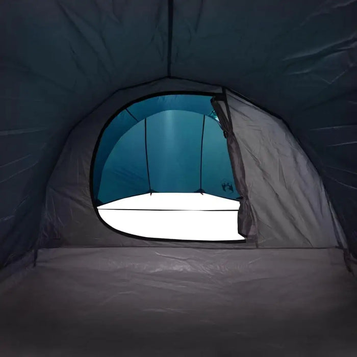 Interior view of blue taffeta camping tent for 4 persons with open front flap.