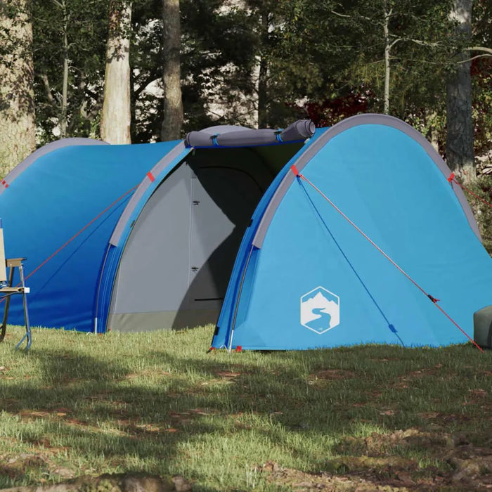 Blue taffeta 4-person camping tent set up in a forest clearing